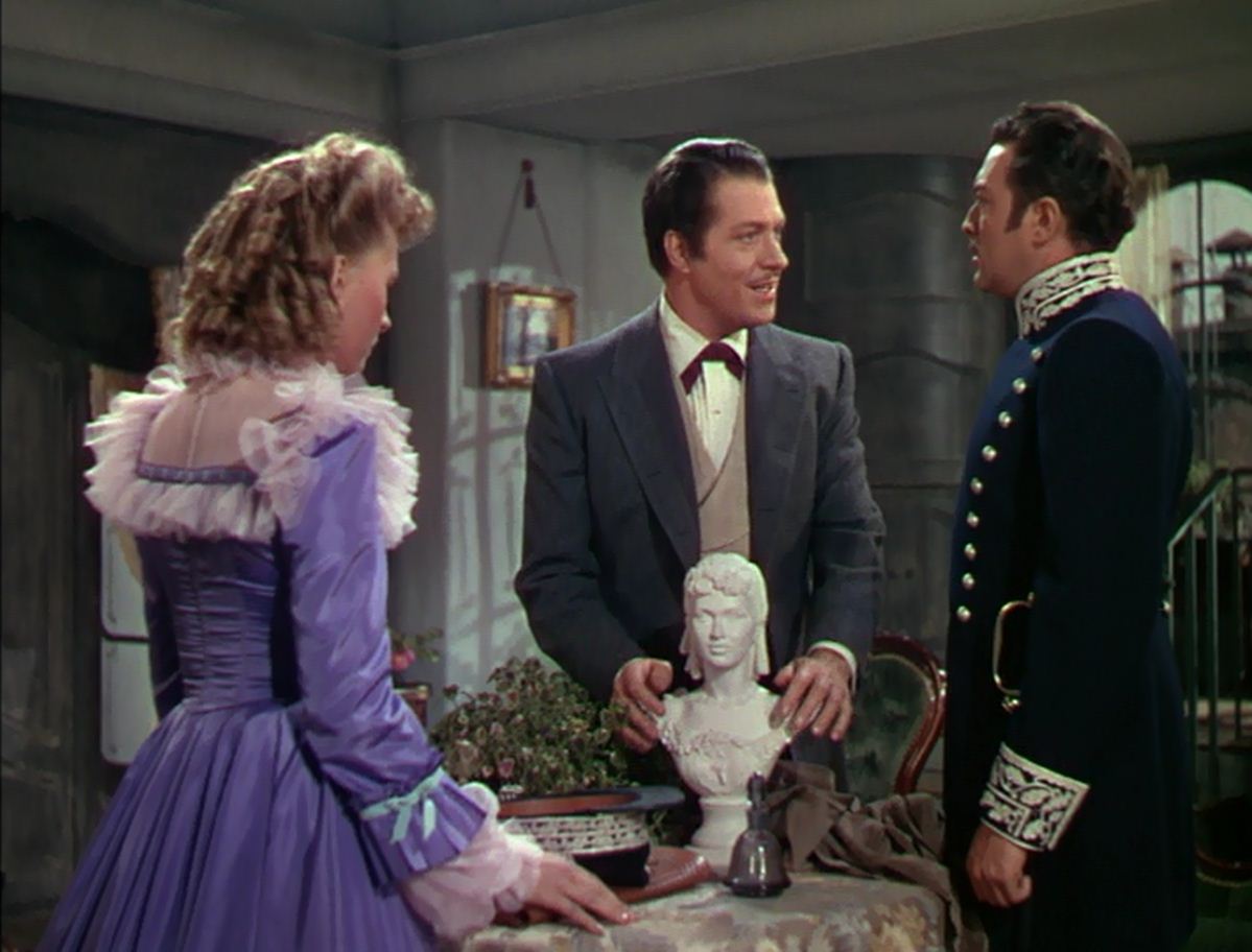 A triangle of squares: Susanna Foster, Nelson Eddy, Edgar Barrier. Eddy himself molded the little bust.